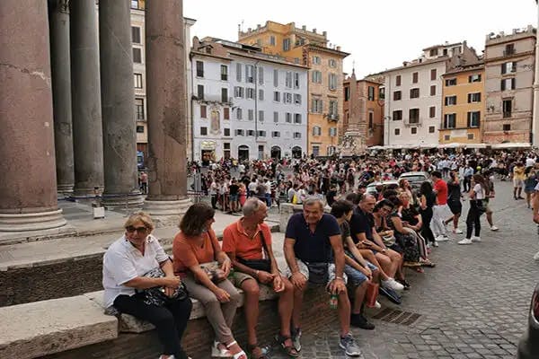 Tourist numbers are still low in Rome, yet outside major historic sites, crowds continue to build.