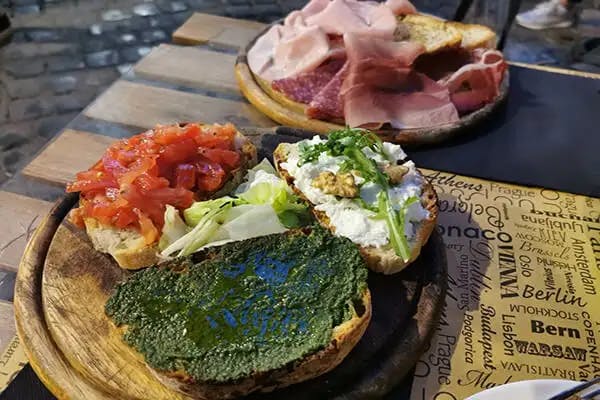 A serving of bruschetta and parma ham from a trattoria in Rome's popular Trastevere district.