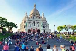 The average visitor arrives in Montmartre and climbs straight up to the Basilica de Sacre-Coeur (pictured) or Place du Tertre.