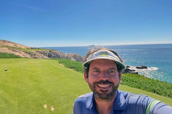 Here's a selfie I took in what I think of as my front yard: the golf course in the community where I live in Cabo.