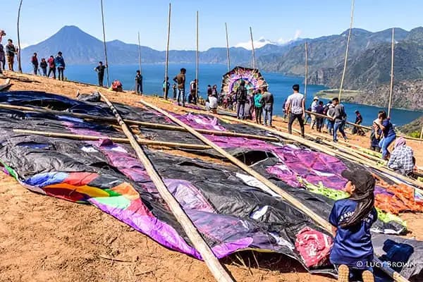 Preparations for Giant Kite Festival overlooking Lake Atitlán with San Pedro Volcano on the far shore. ©Lucy Brown