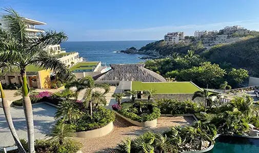 A view in a luxury community like this, right on the beach, in one of Huatulco's most desirable areas, Tangolunda, will run you around half-million. This particular condo is a penthouse for $589,000, and it's available now, as are two two-bedroom condos 