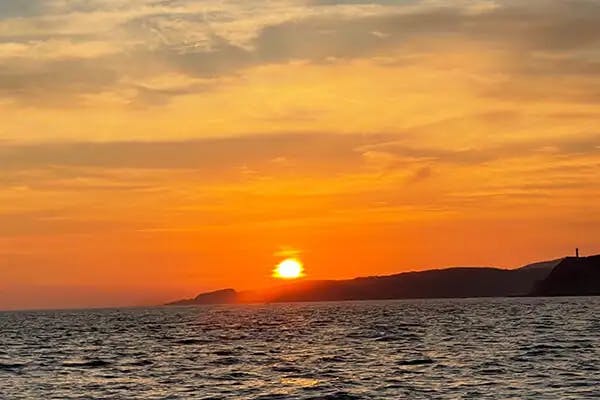 Thanks to its geographic position, the sun sets over the rocky peninsulas along Huatulco's coast. Many homes have an ocean view, but sunset views are more rare. I took this shot from a boat out in one of the Huatulco's nine bays.